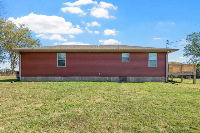 a backyard of a house with lots of green space