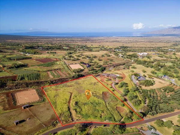 an aerial view of residential building and ocean