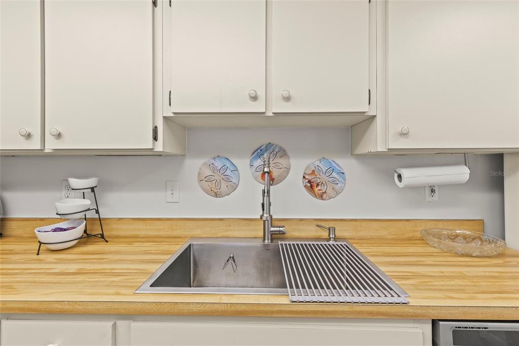 12760 Indian Rocks Road, Unit 571 Largo, FL 33774 - Photo 17 of 39 a view of kitchen and utility room with cabinets