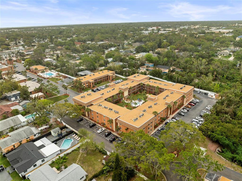 12760 Indian Rocks Road, Unit 571 Largo, FL 33774 - Photo 3 of 39 an aerial view of residential houses with outdoor space