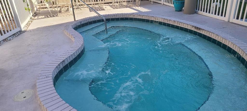 12760 Indian Rocks Road, Unit 571 Largo, FL 33774 - Photo 36 of 39 a balcony with view of swimming pool