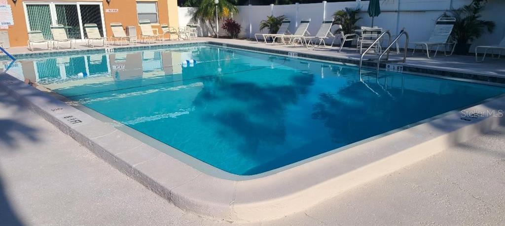 12760 Indian Rocks Road, Unit 571 Largo, FL 33774 - Photo 37 of 39 a view of swimming pool from a balcony