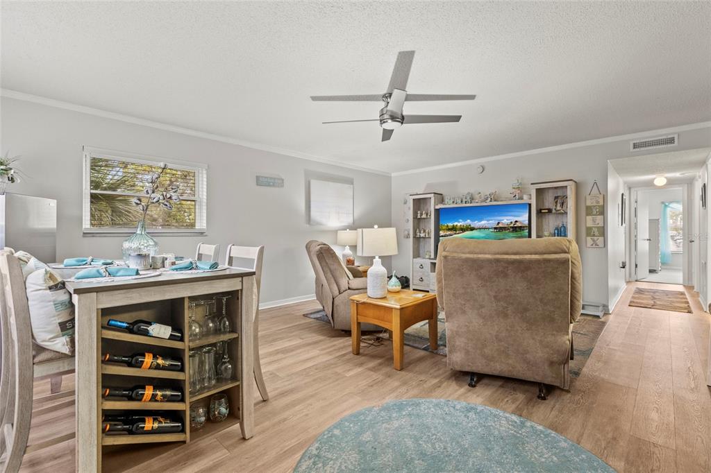 12760 Indian Rocks Road, Unit 571 Largo, FL 33774 - Photo 10 of 39 a living room with furniture and a wooden floor