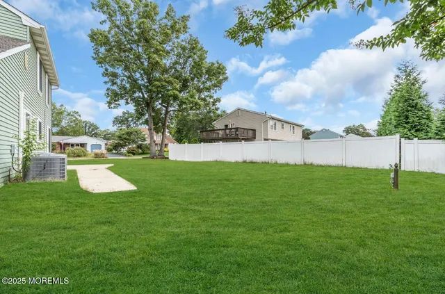 a view of a garden with a house