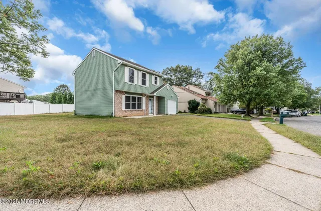 a front view of house with yard
