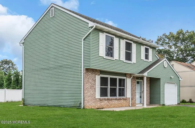 front view of a house with a yard