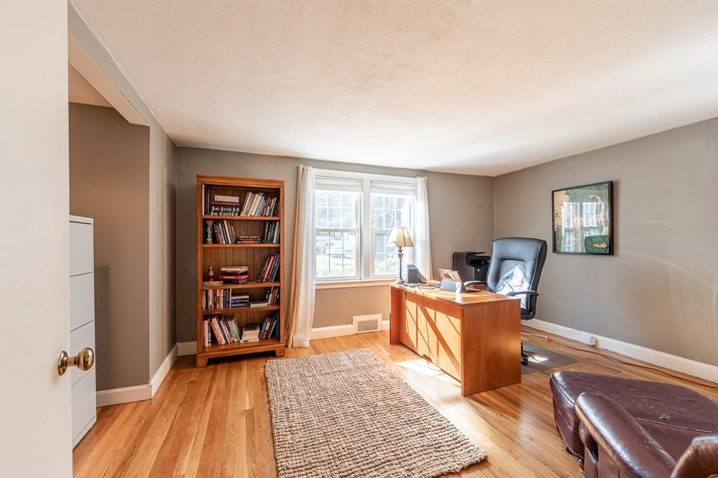 21 Gleason Road Reading, MA 01867 - Photo 25 of 42 a living room with furniture and a wooden floor
