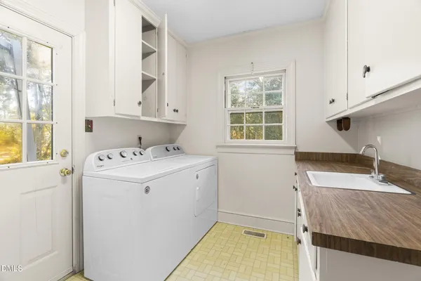 a utility room with dryer and washer