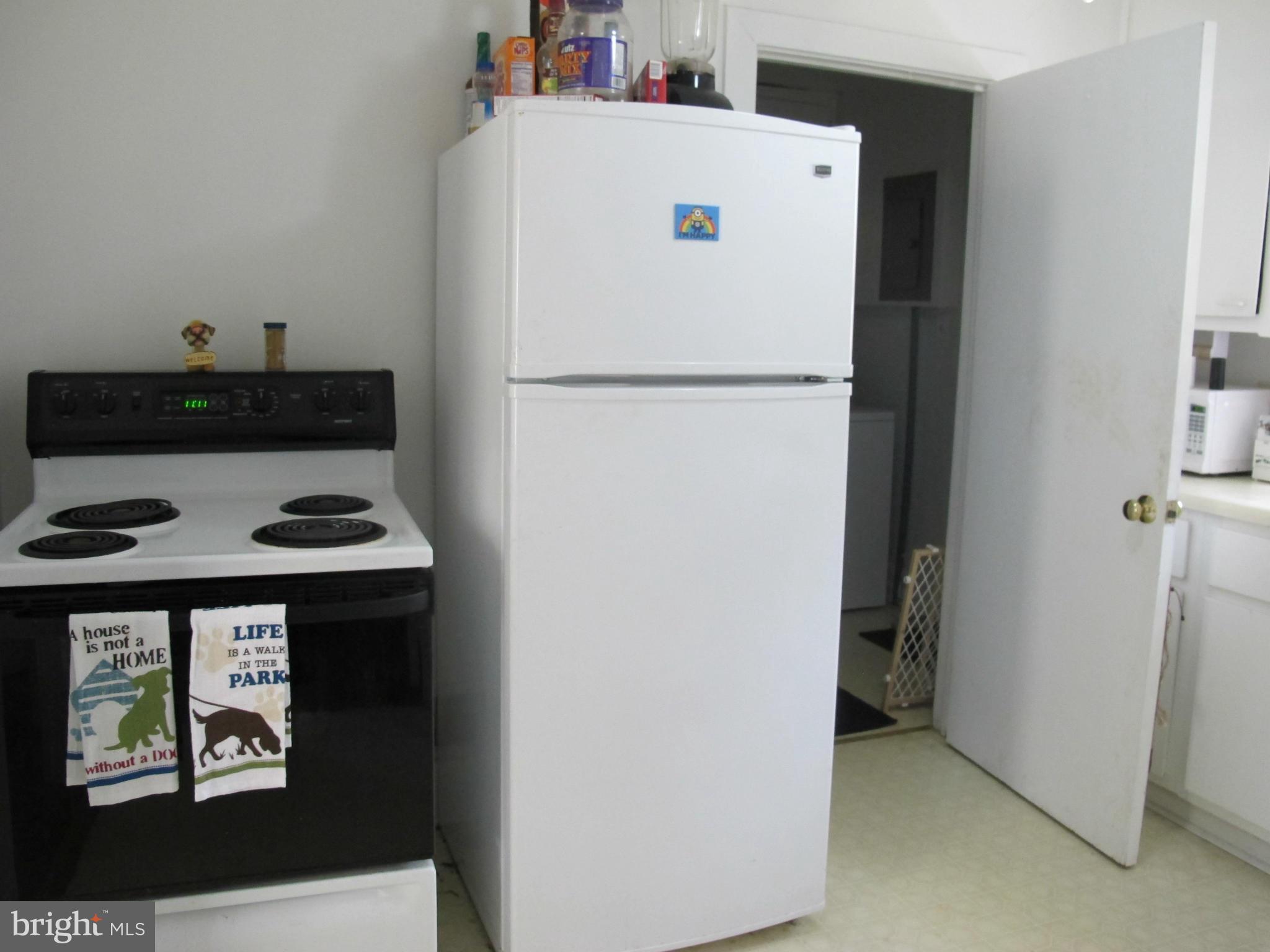 607 Waterloo Road Warrenton, VA 20186 - Photo 5 of 16 a white refrigerator freezer sitting inside of a kitchen