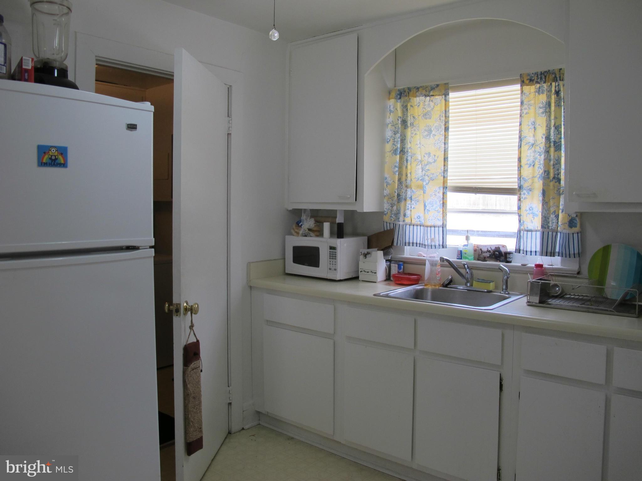 607 Waterloo Road Warrenton, VA 20186 - Photo 7 of 16 a kitchen with a sink a window and cabinets