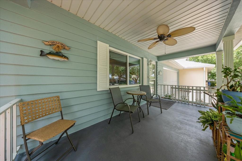 8720 Southwest 90th Street, Unit A Ocala, FL 34481 - Photo 5 of 71 a view of a porch with furniture and a yard
