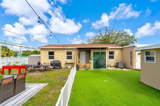 a front view of house with yard patio and green space
