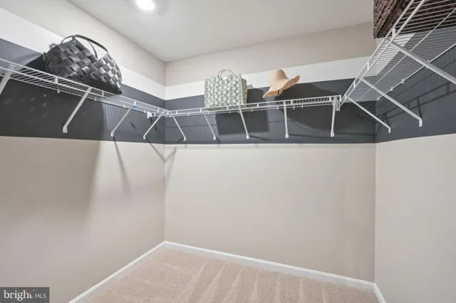 a view of a chairs and table in patio next to a yard