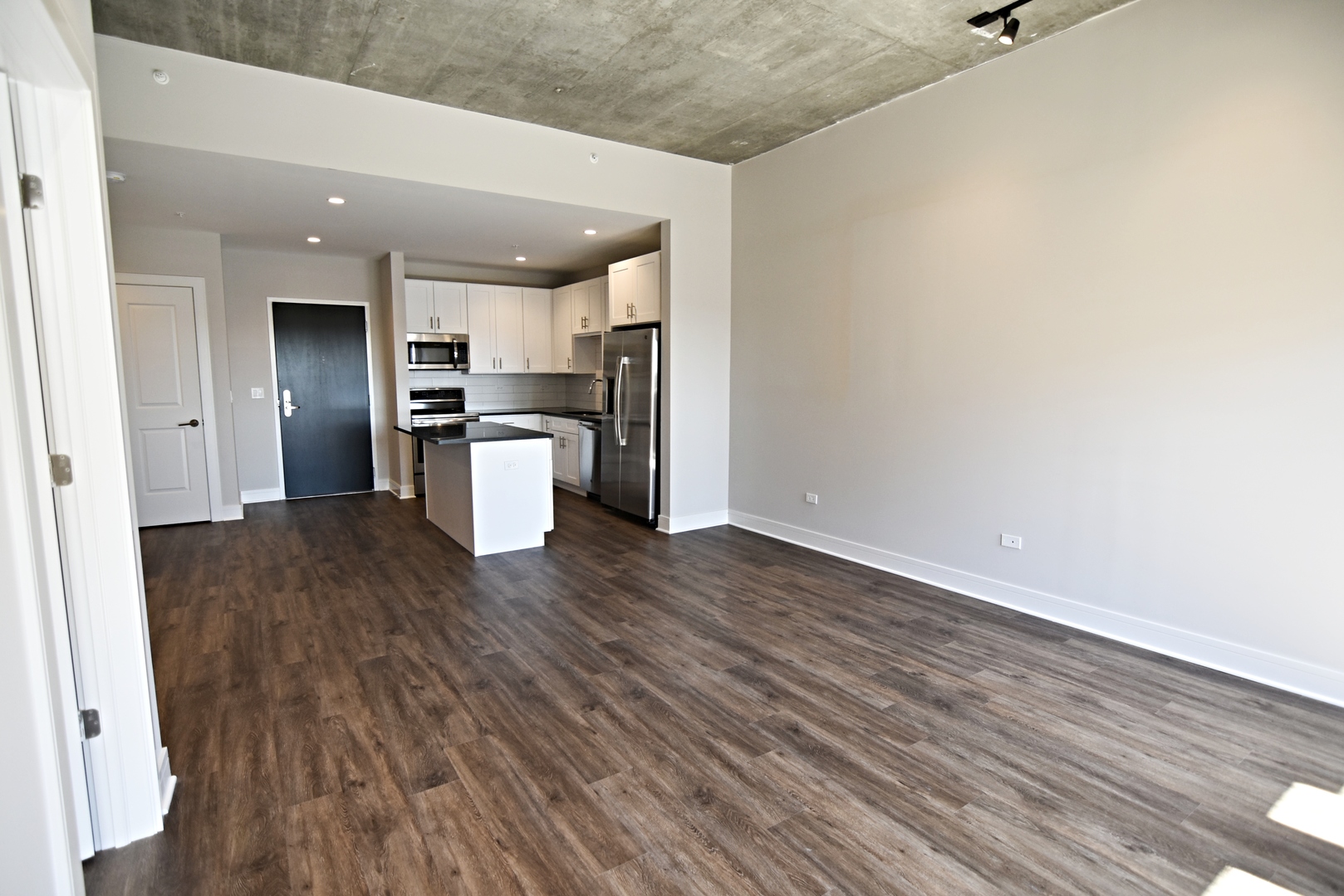 3833 North Broadway, Unit 409 Chicago, IL 60613 - Photo 8 of 14 a kitchen with a refrigerator and a stove top oven