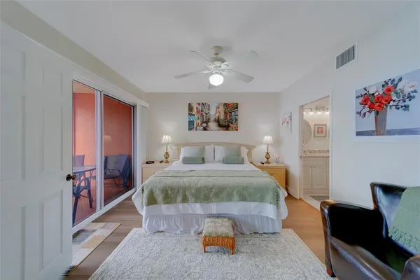 a bathroom with a granite countertop double vanity sink and a mirror