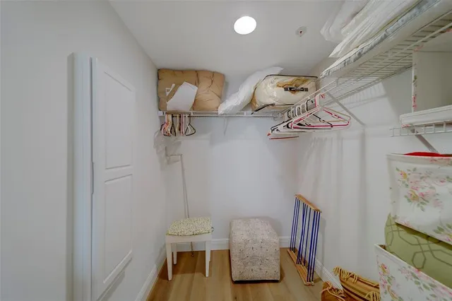 a bedroom with two beds and a window