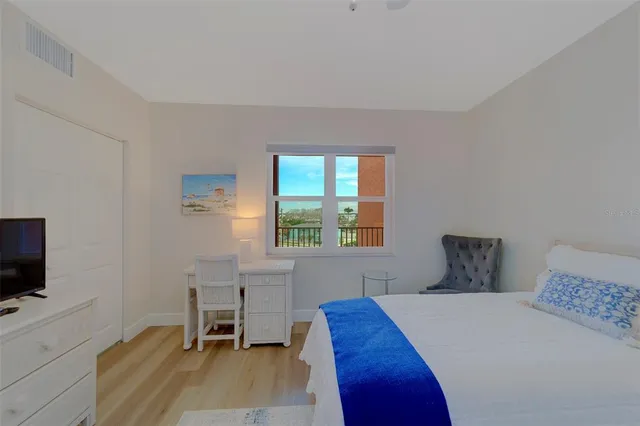 a bedroom with bed and window