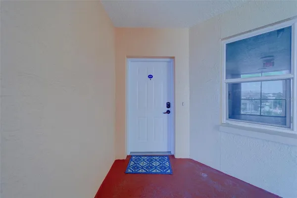 a view of living room filled with furniture and window