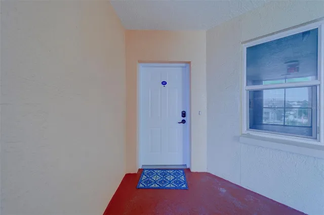 a view of living room filled with furniture and window