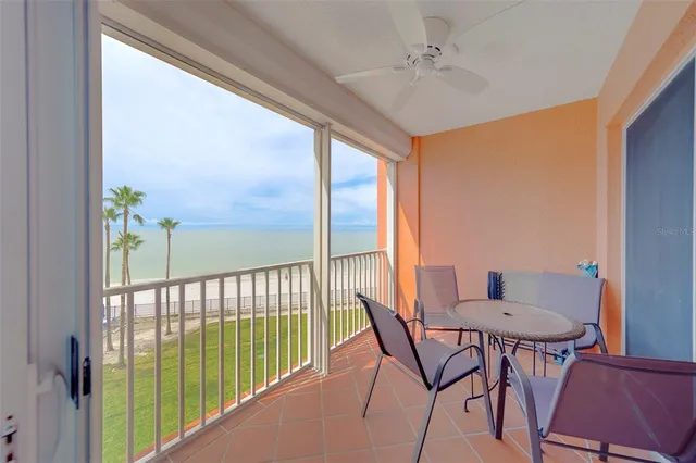 a view of a livingroom with furniture and a window