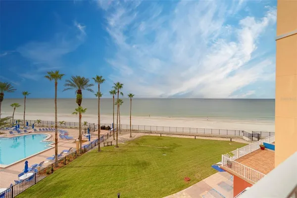 a lobby with furniture and floor to ceiling window