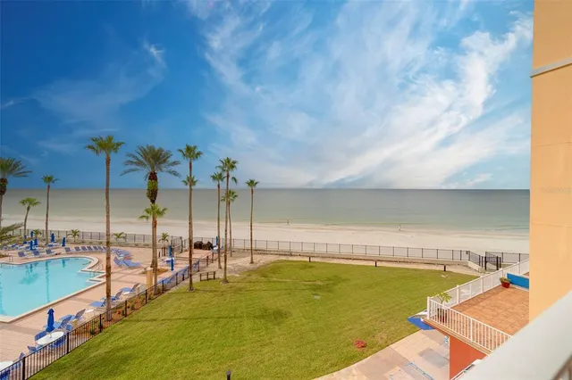 a lobby with furniture and floor to ceiling window