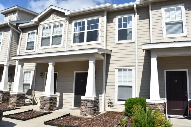 a front view of a building with a street