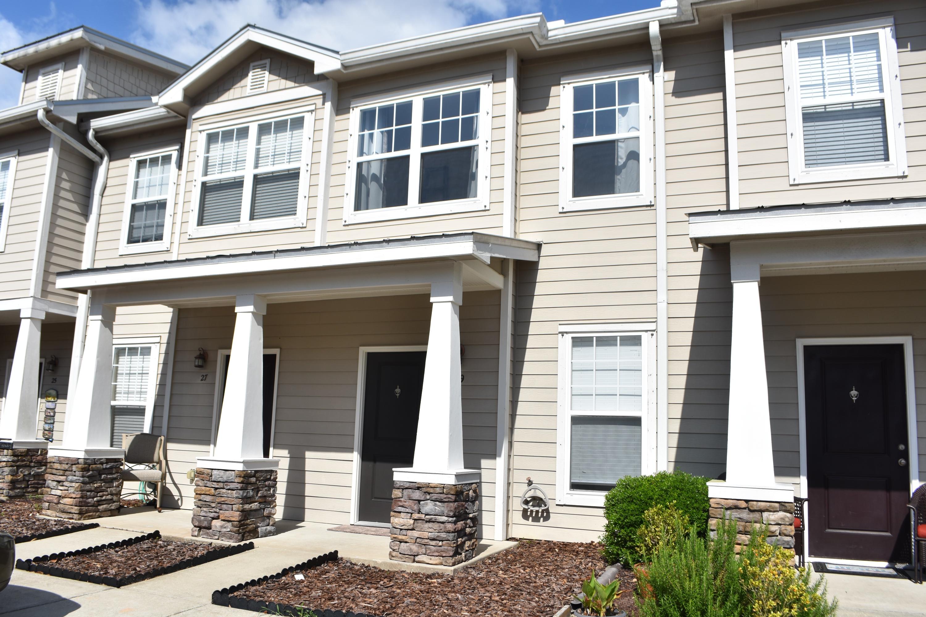 a front view of a building with a street