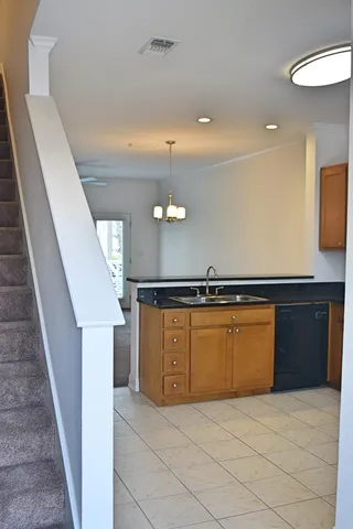 a view of a kitchen with a sink