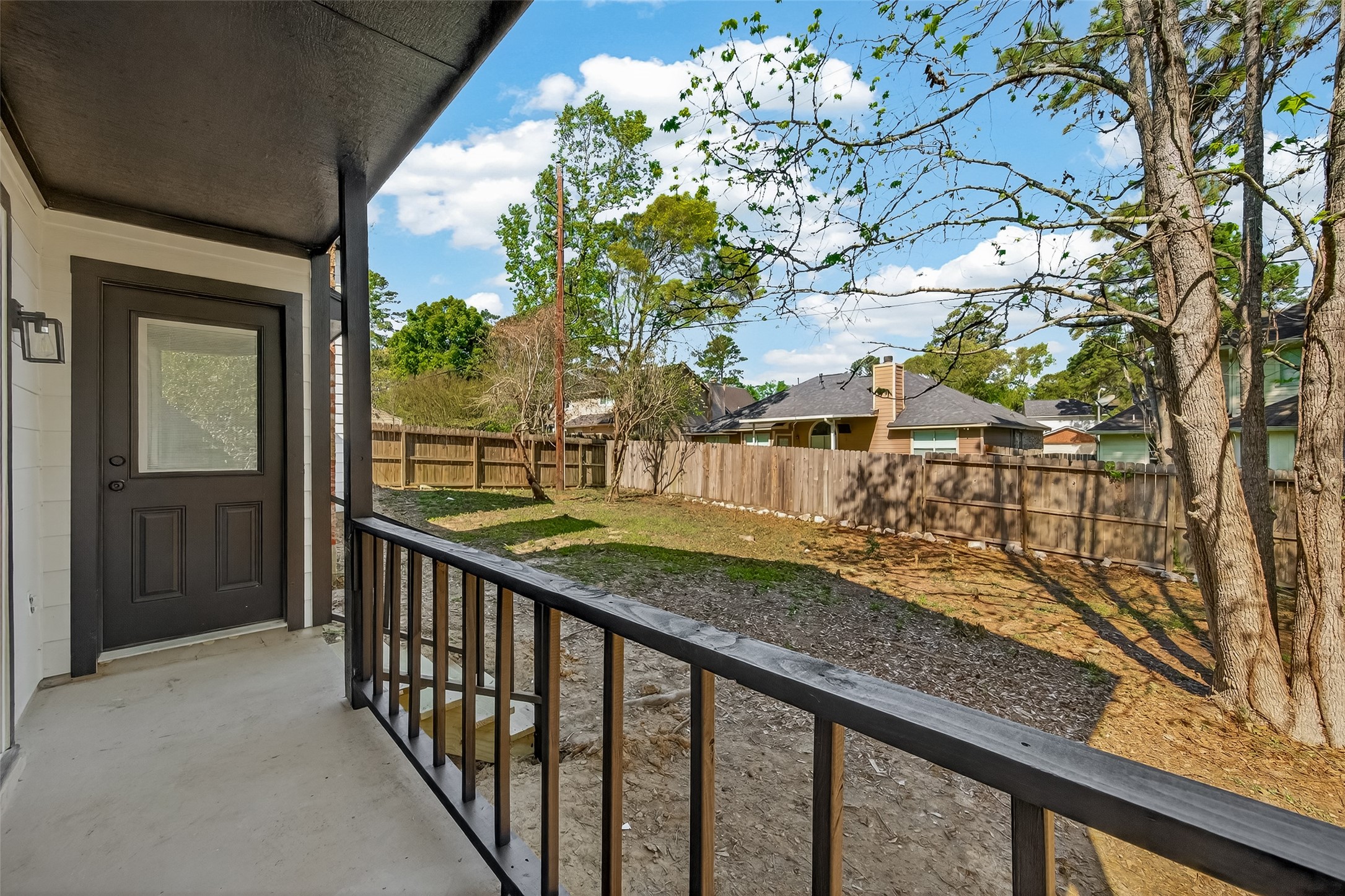 2915 Whispering Springs Drive Spring, TX 77373 - Photo 35 of 36 Outdoor living space with views of the yard and mature trees, ideal for gatherings.