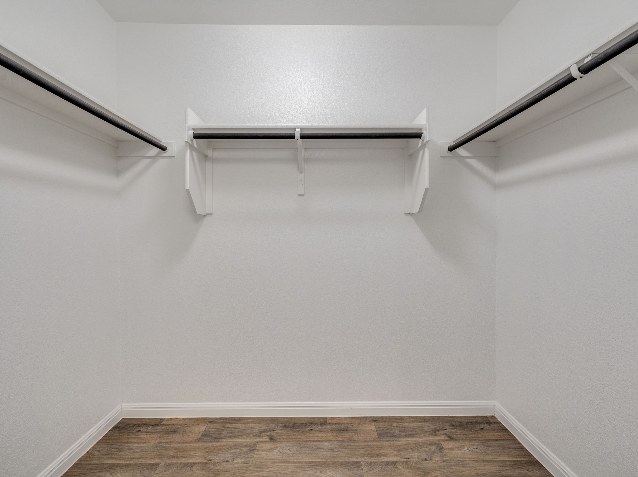136 Dunlin Lane Leander, TX 78641 - Photo 14 of 24 Walk in closet featuring dark wood-style floors