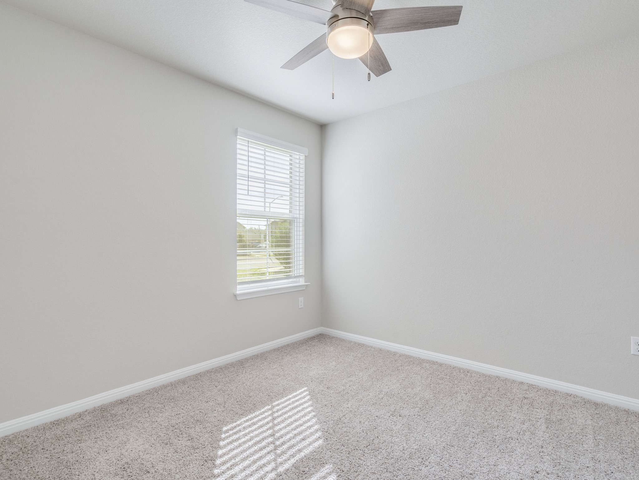 136 Dunlin Lane Leander, TX 78641 - Photo 15 of 24 Unfurnished room with ceiling fan and light carpet