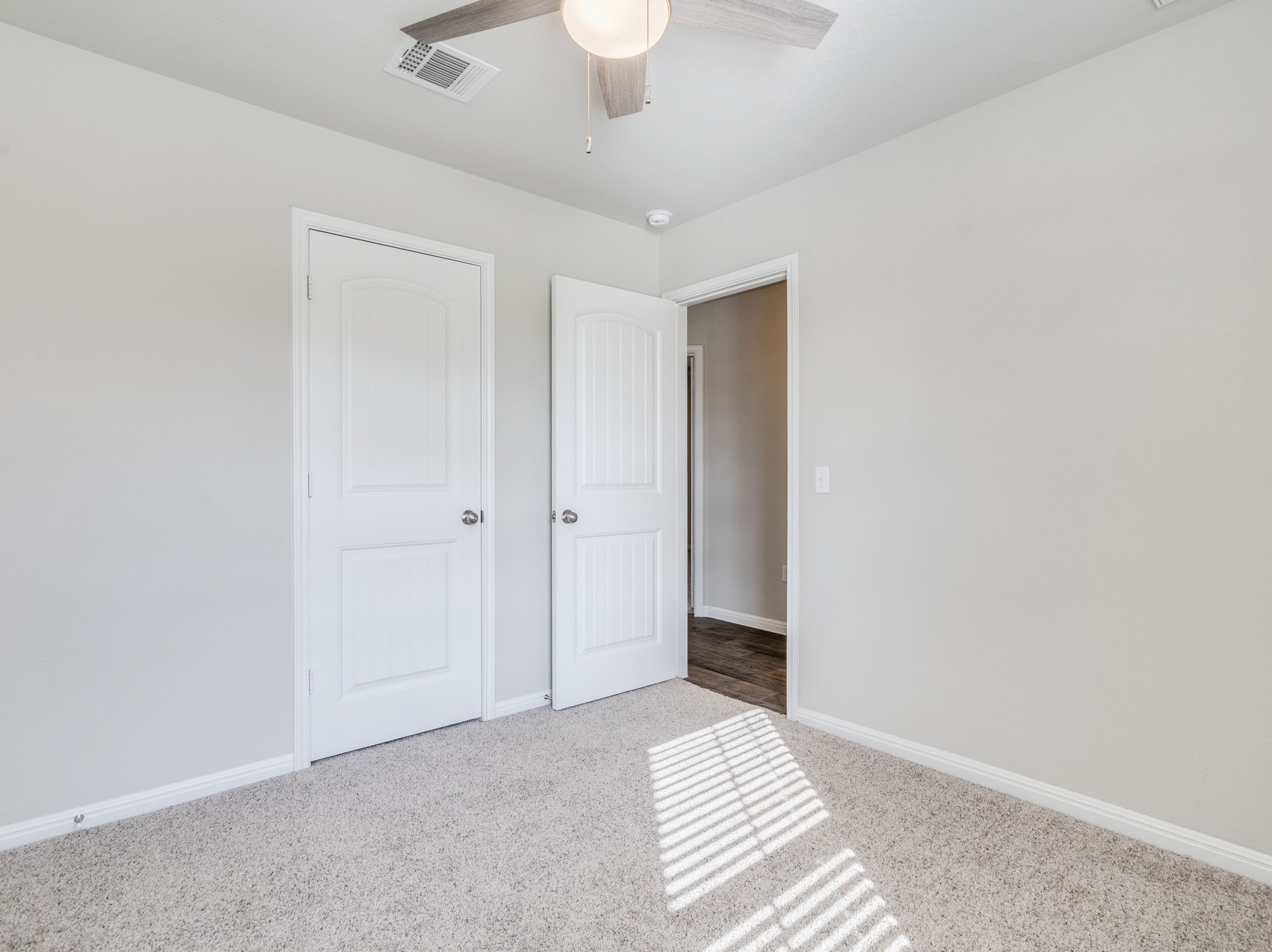 136 Dunlin Lane Leander, TX 78641 - Photo 16 of 24 Unfurnished bedroom featuring light colored carpet and ceiling fan