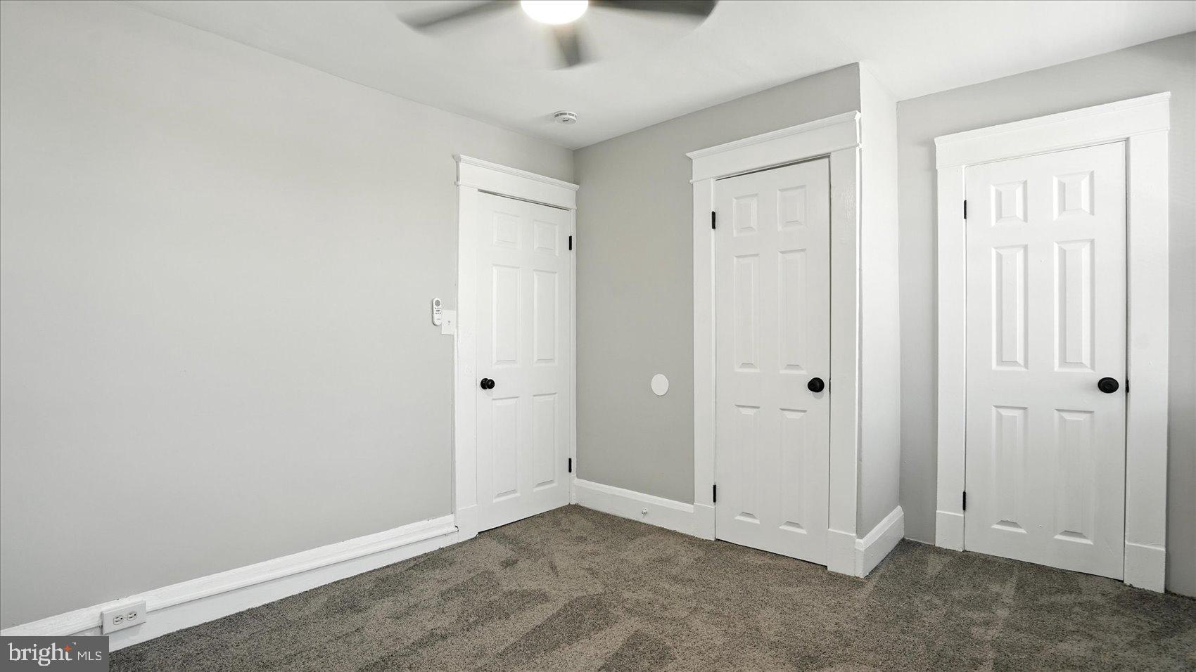 111 Eastern Boulevard Essex, MD 21221 - Photo 24 of 33 an empty room with a ceiling fan and a window