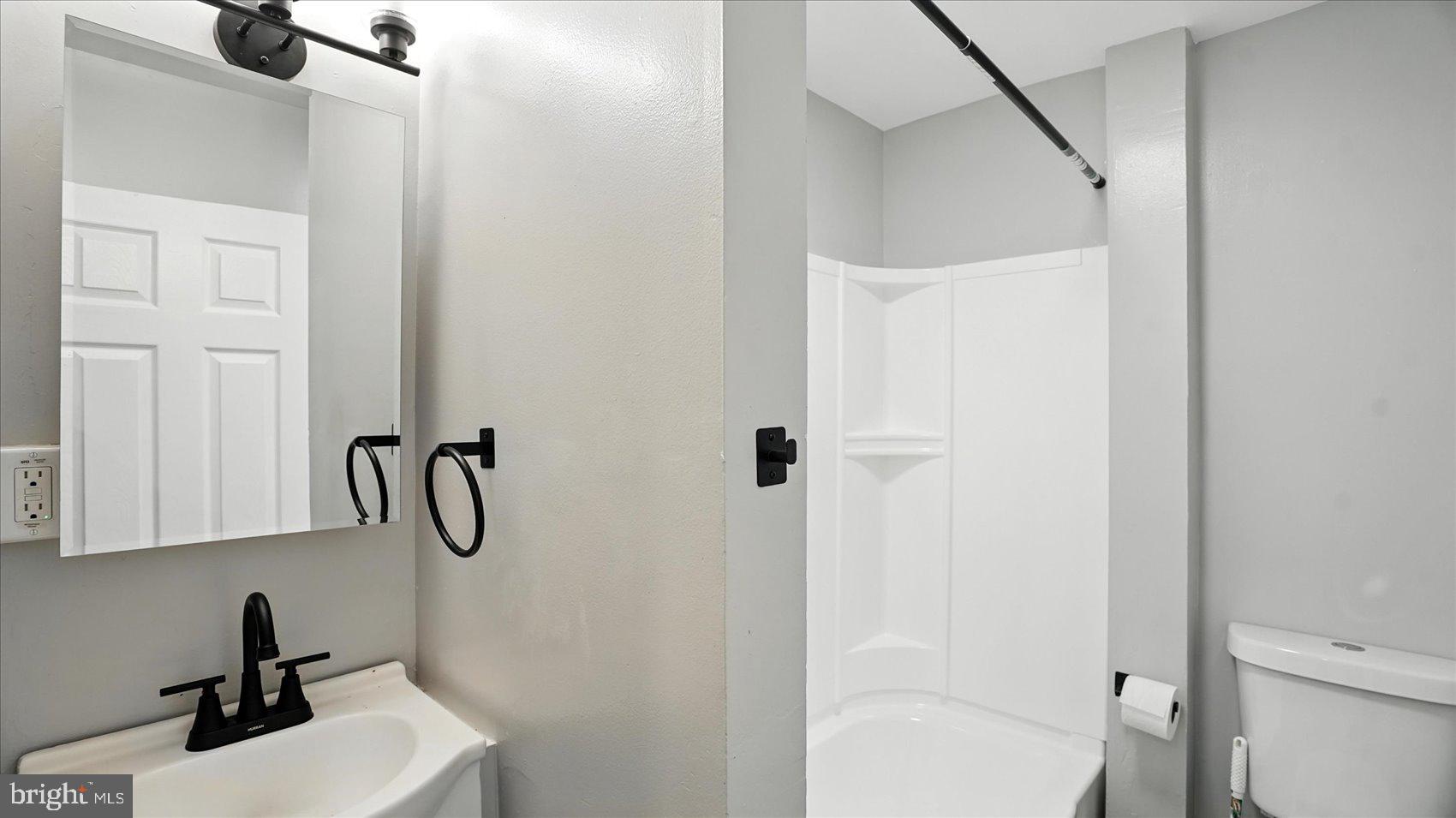 111 Eastern Boulevard Essex, MD 21221 - Photo 26 of 33 a bathroom with a sink a toilet and a shower