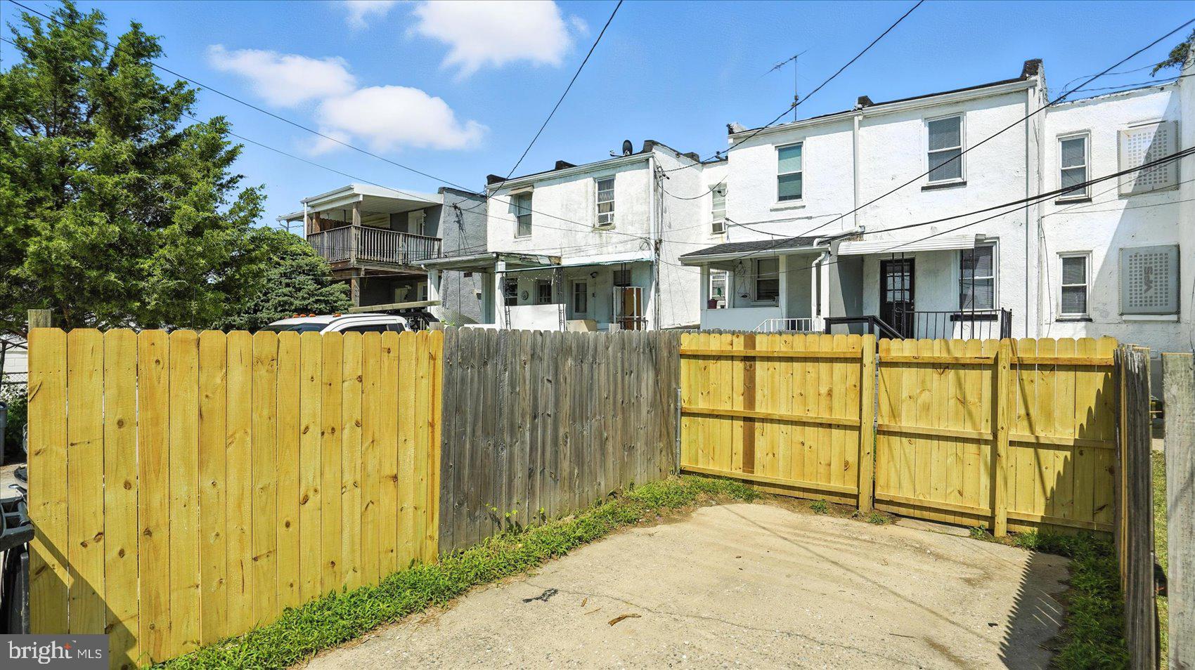 111 Eastern Boulevard Essex, MD 21221 - Photo 33 of 33 a view of a blue house with large windows and fence