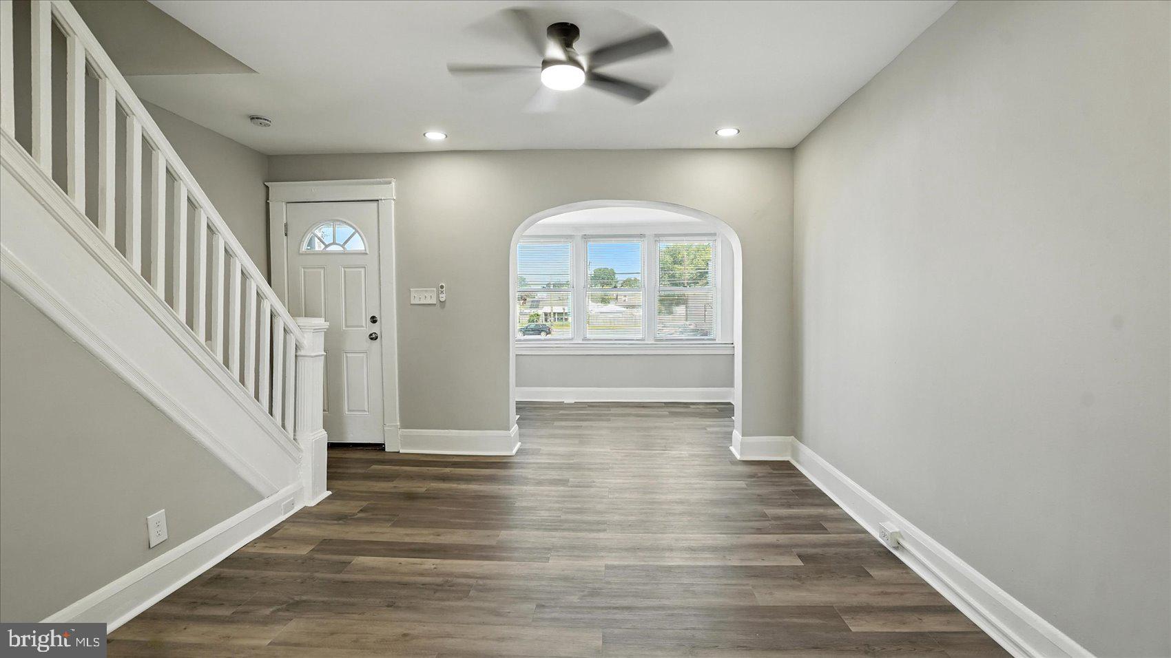 111 Eastern Boulevard Essex, MD 21221 - Photo 5 of 33 wooden floor in an empty room with a window