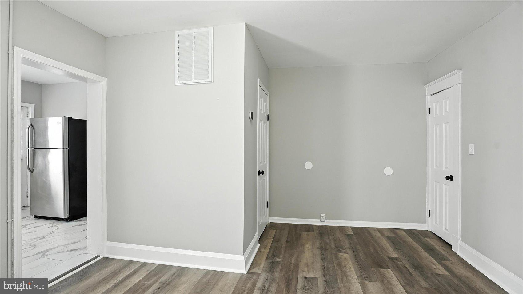 111 Eastern Boulevard Essex, MD 21221 - Photo 10 of 33 a view of an empty room with wooden floor and closet