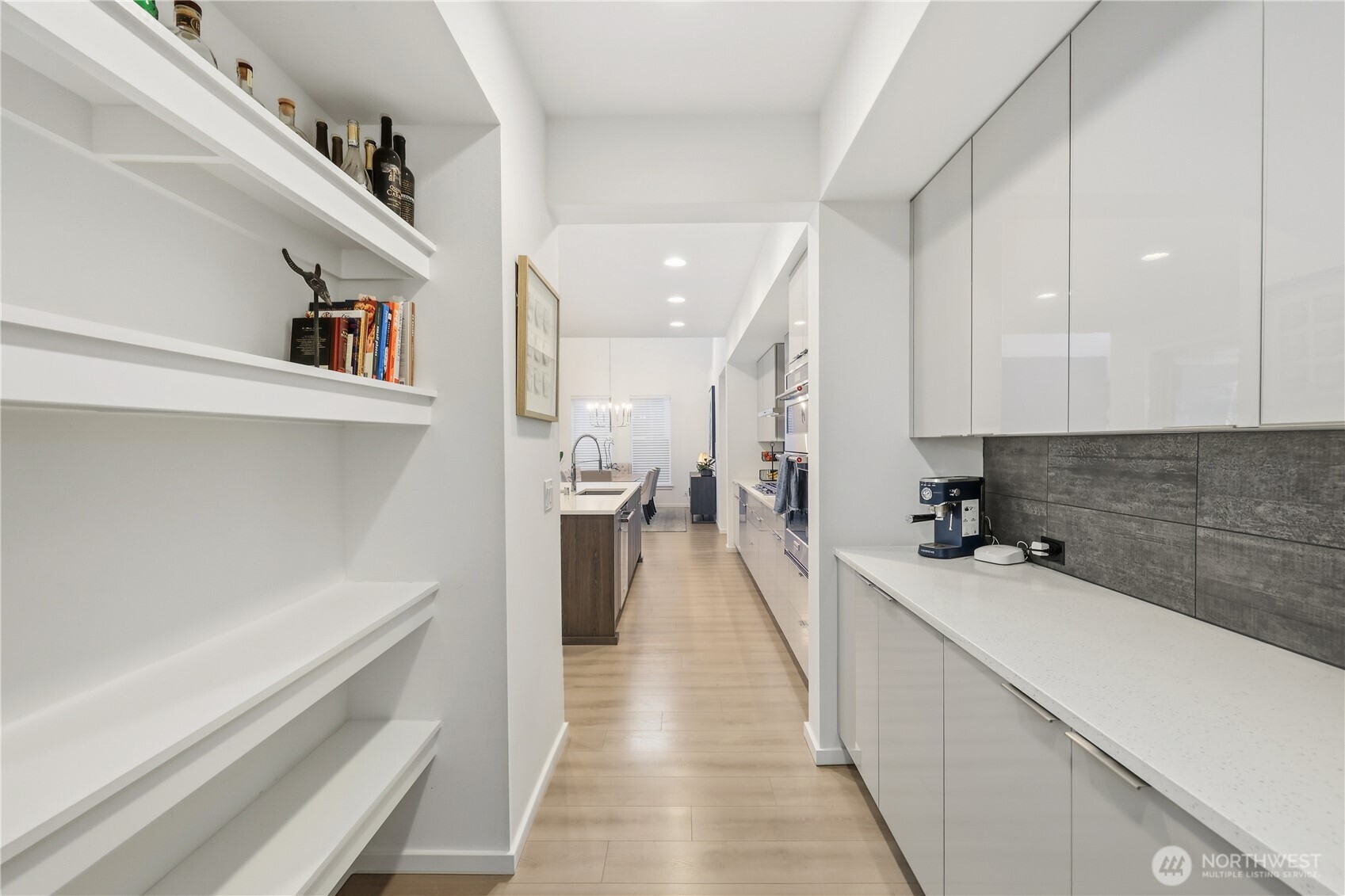 5661 Great Gln Road Southwest Port Orchard, WA 98367 - Photo 11 of 40 a kitchen with a sink and refrigerator