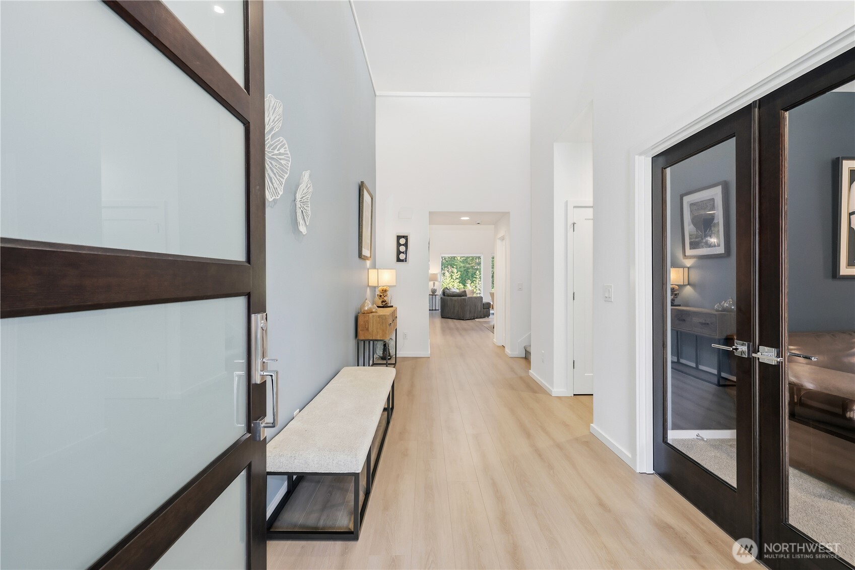 5661 Great Gln Road Southwest Port Orchard, WA 98367 - Photo 2 of 40 a view of a hallway with wooden floor and staircase
