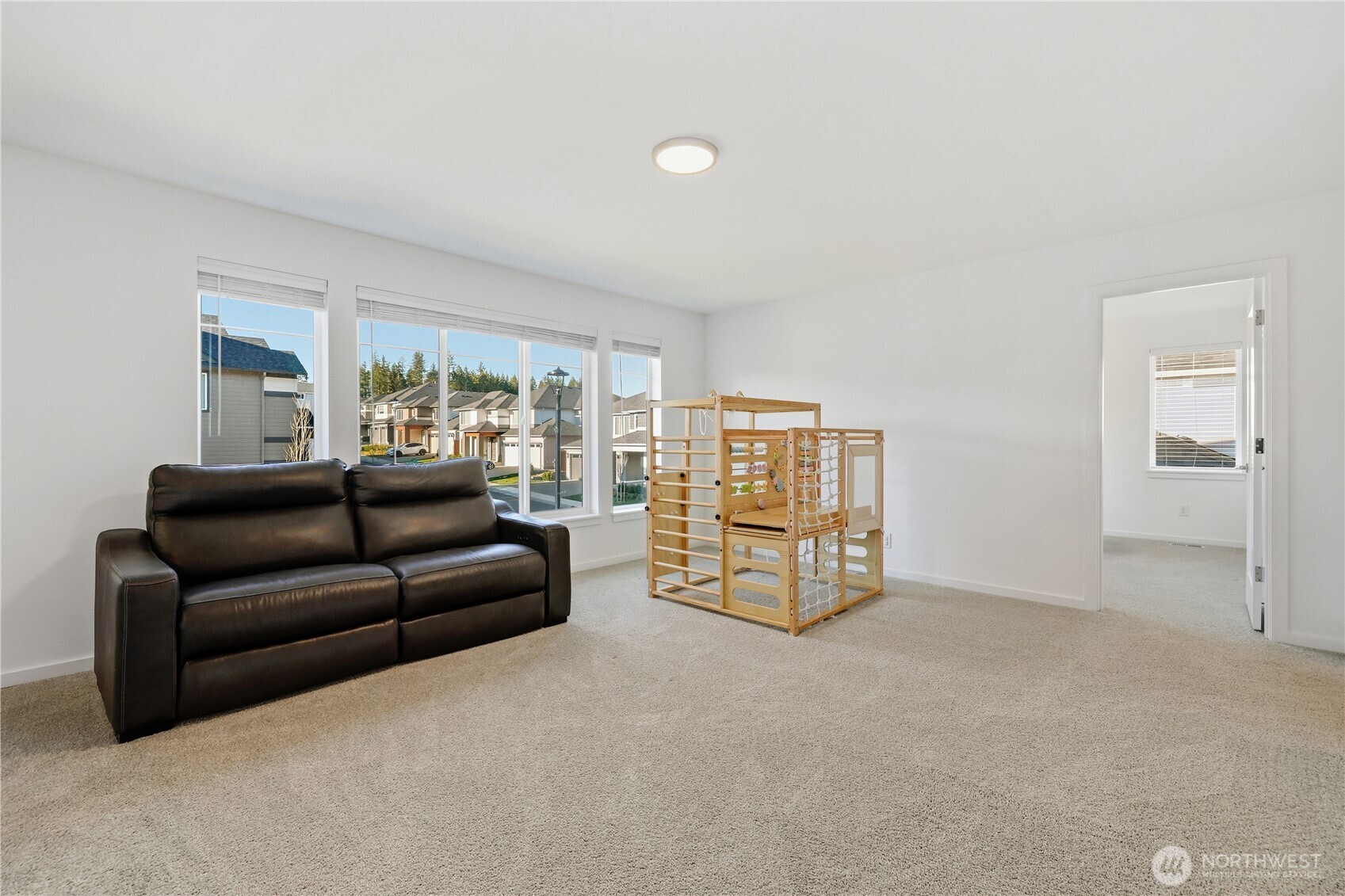 5661 Great Gln Road Southwest Port Orchard, WA 98367 - Photo 22 of 40 a living room with furniture and a book shelf