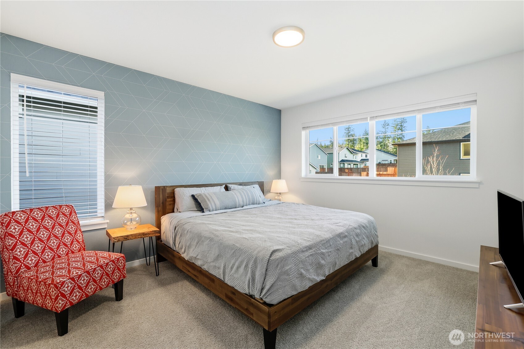 5661 Great Gln Road Southwest Port Orchard, WA 98367 - Photo 26 of 40 a bedroom with bed and a couch