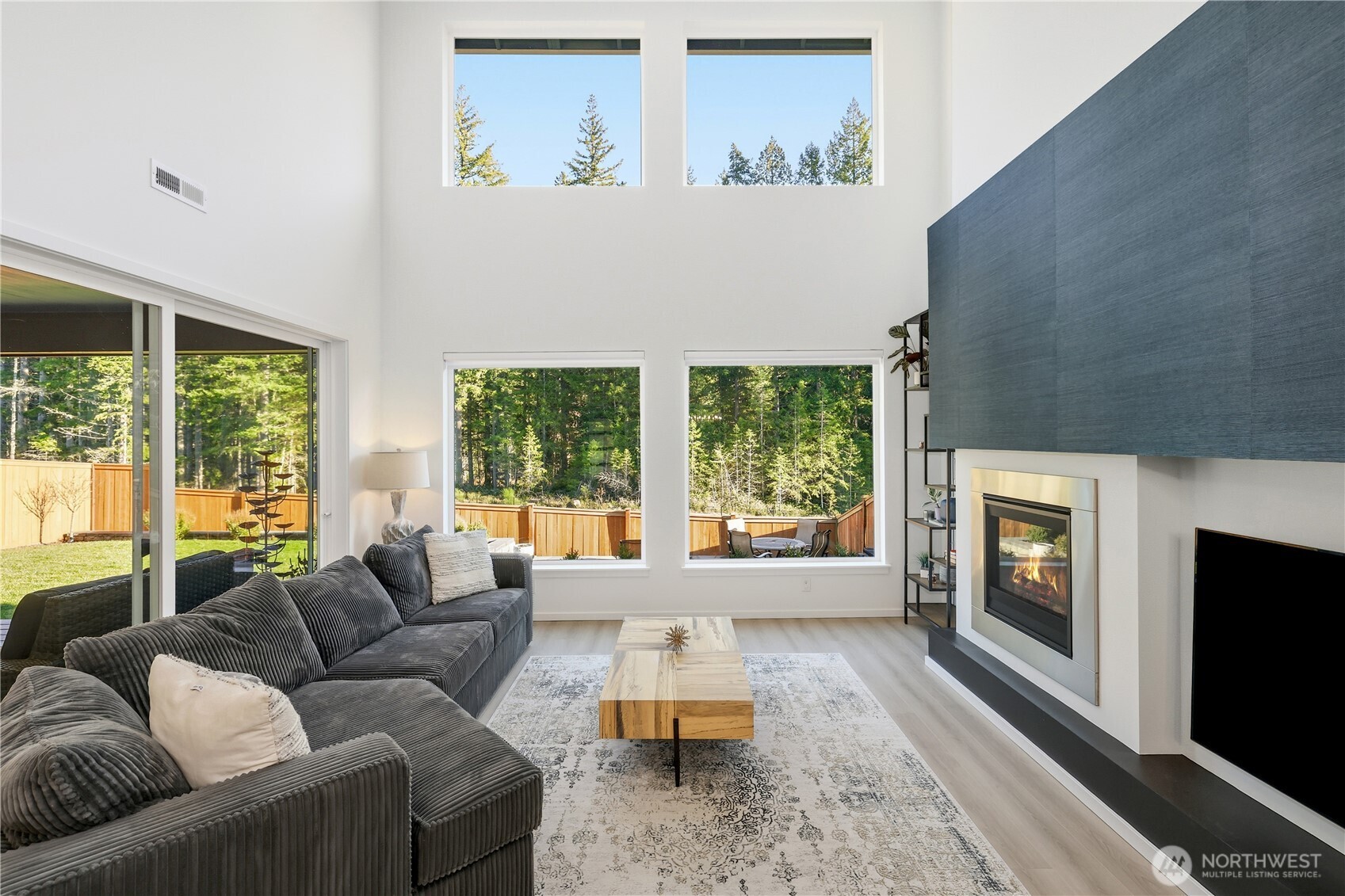 5661 Great Gln Road Southwest Port Orchard, WA 98367 - Photo 4 of 40 a living room with furniture and a fireplace