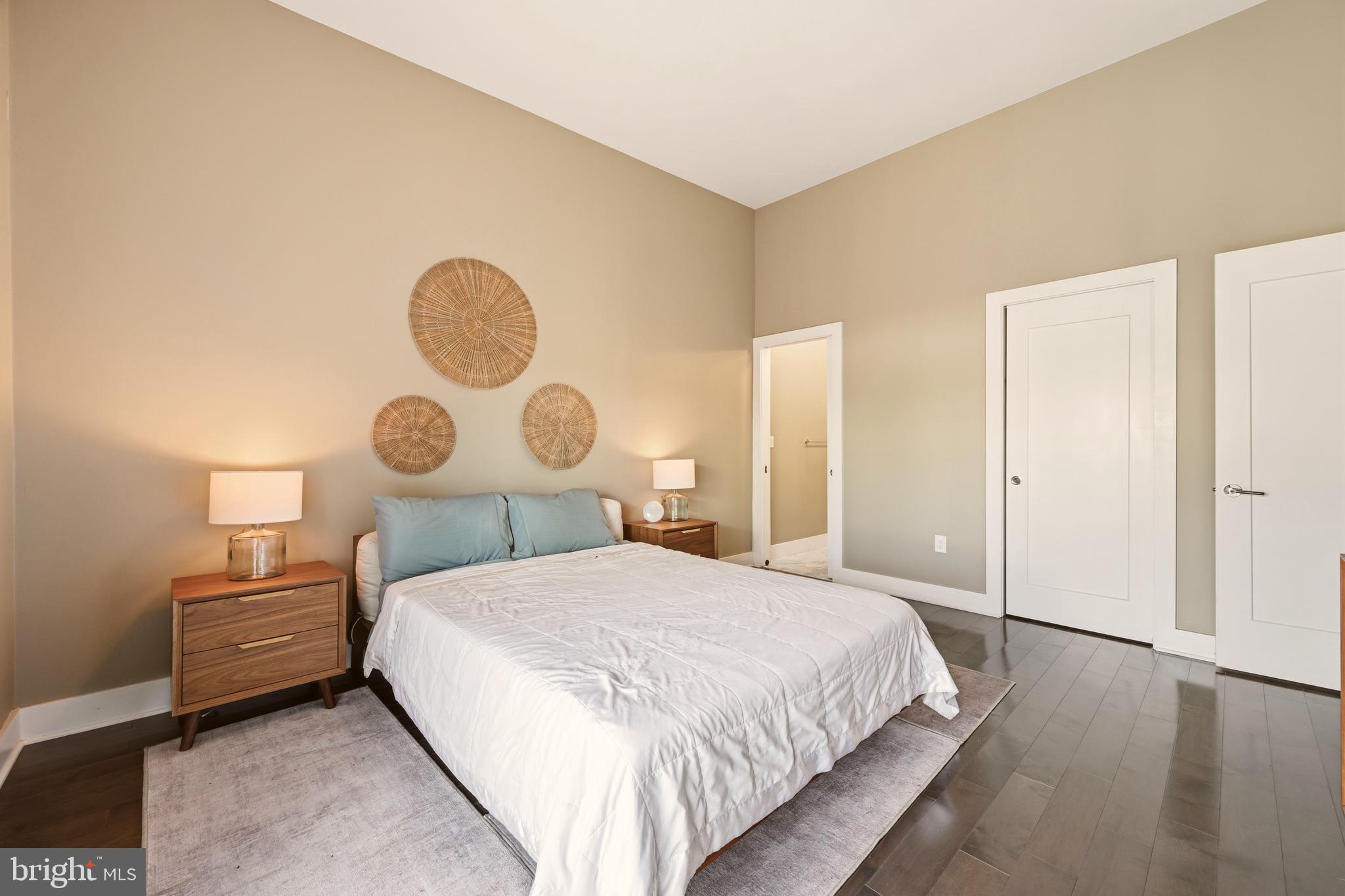 630 14th Street Northeast, Unit 5 Washington, DC 20002 - Photo 12 of 24 a bedroom with a bed and a lamp