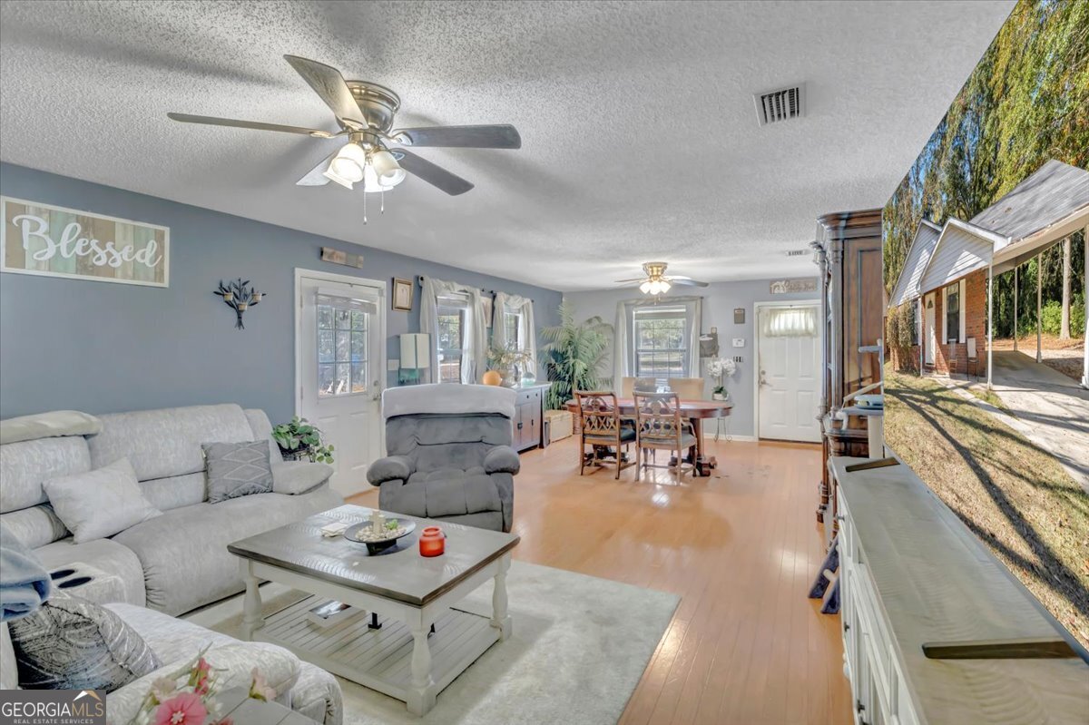 201 Culpepper Street Thomasville, GA 31792 - Photo 13 of 32 a living room with furniture and a large window