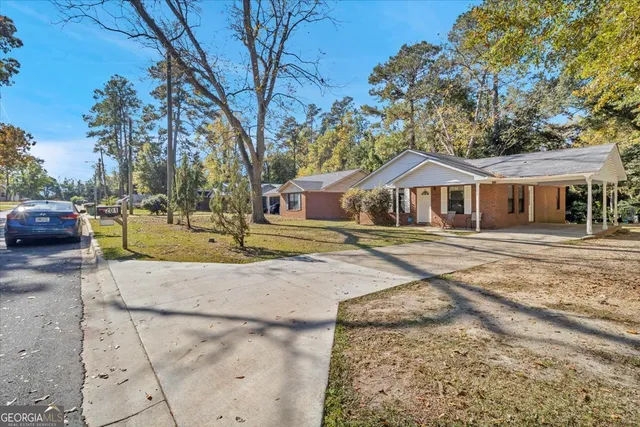 a house with trees in the background