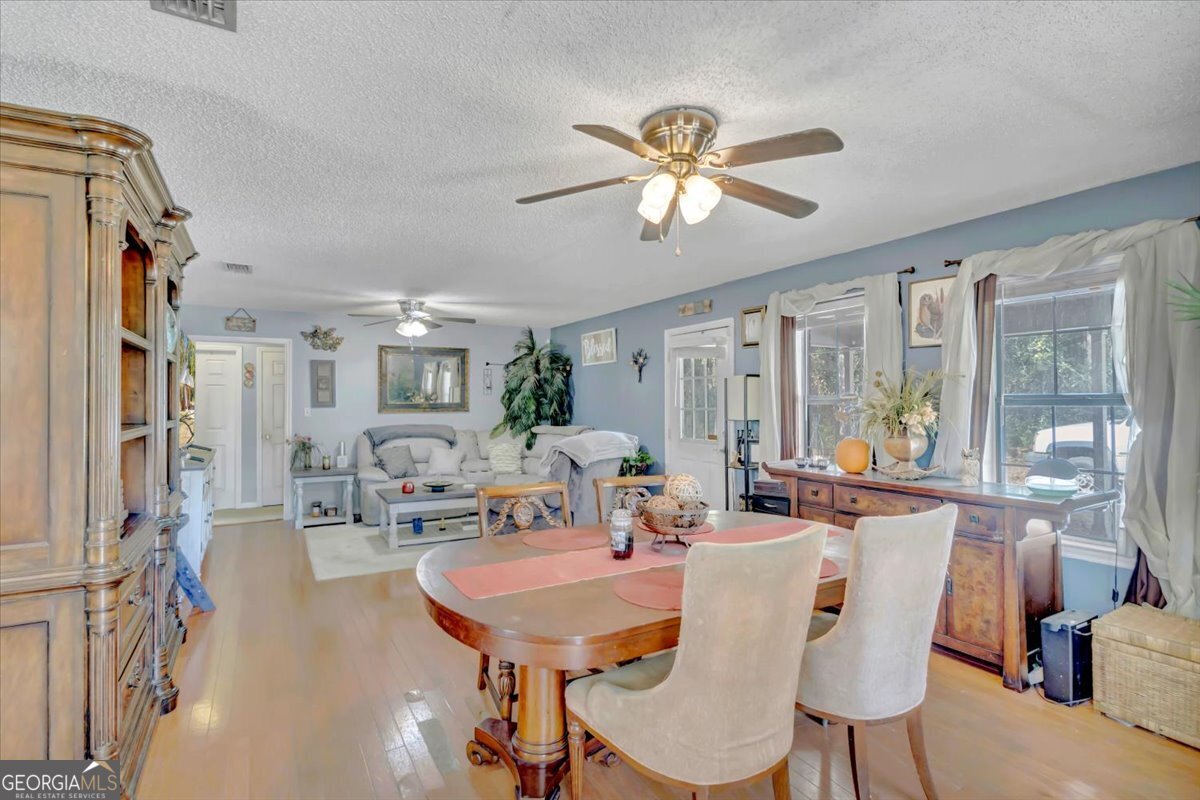 201 Culpepper Street Thomasville, GA 31792 - Photo 9 of 32 a view of a dining room with furniture window and outside view
