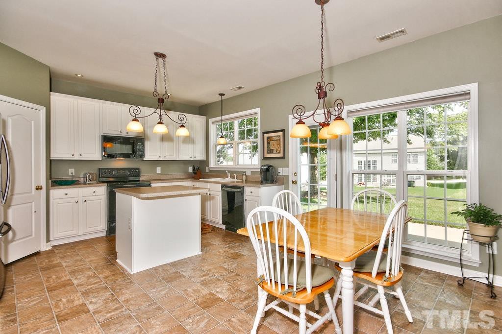 7624 Derek Drive Raleigh, NC 27613 - Photo 8 of 25 a dining table chairs and window