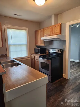 a kitchen with a stove and a microwave
