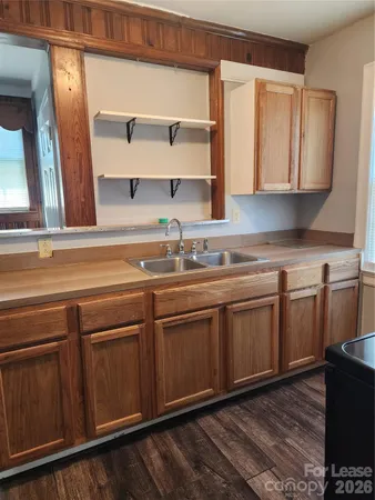 a kitchen with stainless steel appliances granite countertop a sink and cabinets